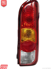 Red tail light for Maruti Eeco vehicle, featuring a clear lens and a yellow-red reflector.