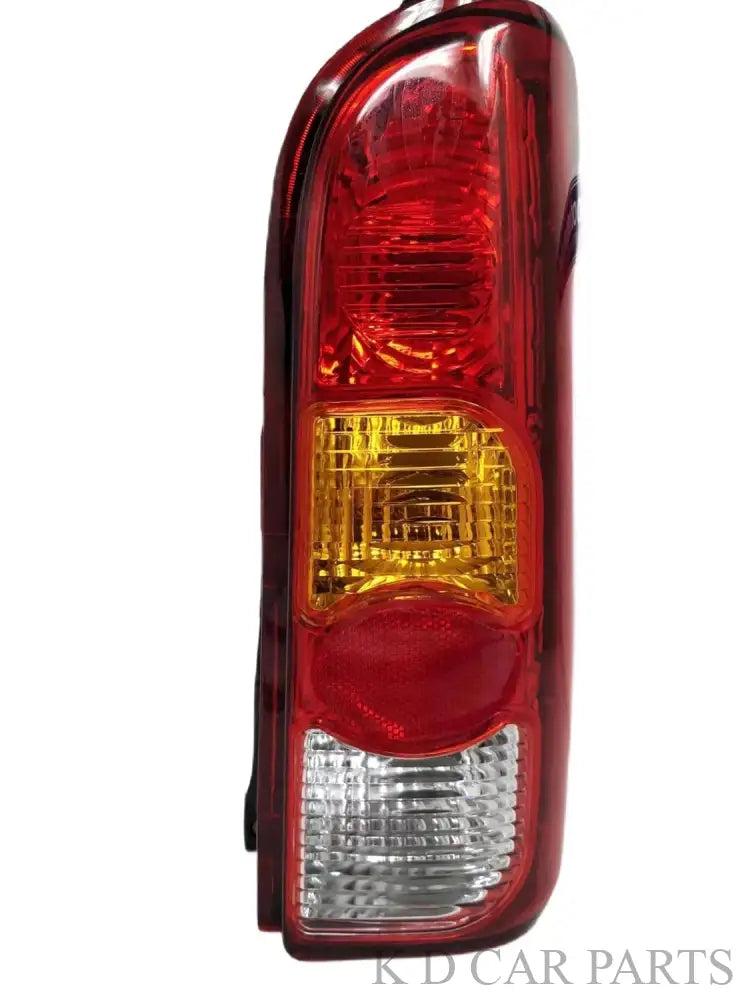 Red tail light for Maruti Eeco vehicle, featuring a clear lens and a yellow-red reflector.