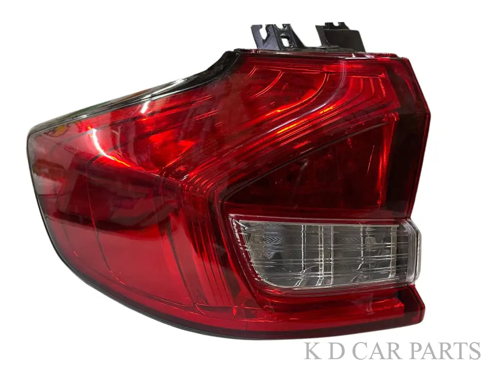 A pair of red and clear taillight assemblies for a Maruti Ertiga vehicle, featuring integrated brake light, tail light, and reverse light sections.
