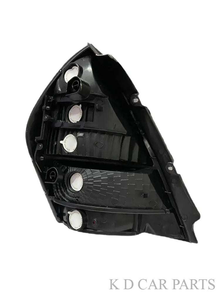 Red tail light for Tata Indigo Type 1 vehicle (2002-2011) with a black border and clear glass.