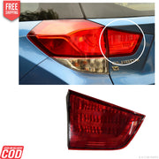 Car tail light assembly with close-up of brand name on a white background