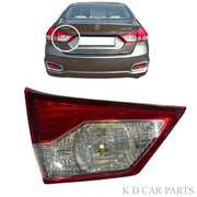 Car tail light assembly with a car in the background