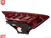 Red car headlight assembly on a white background